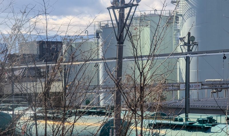 Fuel depot tanks beside a rail siding